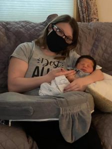 Shows photo of woman holding baby